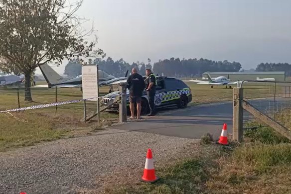 Police at Mount Beauty airport on Saturday.
