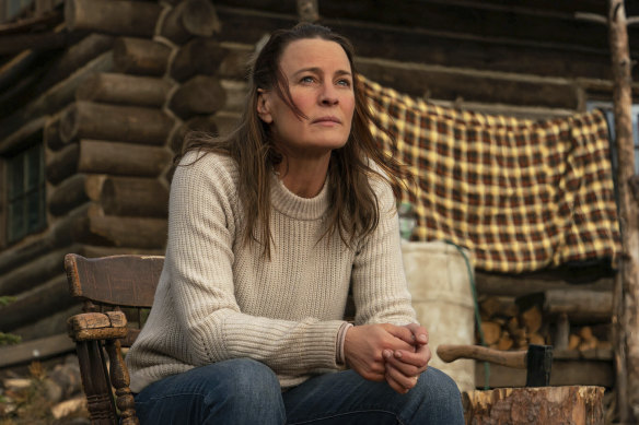 Home on the range: Edee (Robin Wright) on the porch of her mountainside cabin retreat in Land.