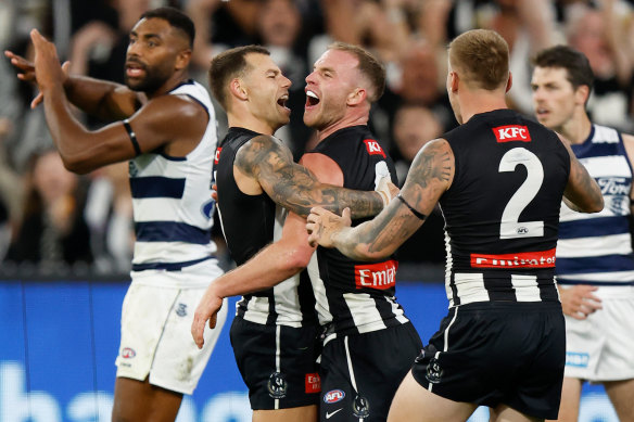 Collingwood’s Jamie Elliott (left) and Tom Mitchell celebrate.