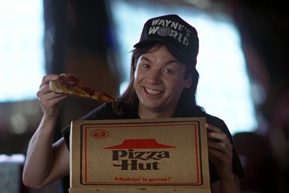 Wayne (Mike Myers) promotes Pizza Hut in a scene from Wayne’s World.