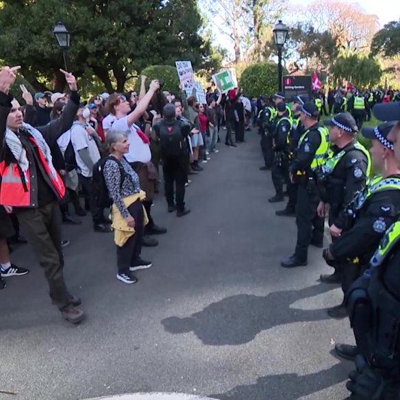 Counter-protesters chant at crowds arriving for an anti-immigration rally in Perth.