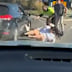 A man has allegedly carjacked a woman on a busy motorway in Sydney’s west with two kids in tow.