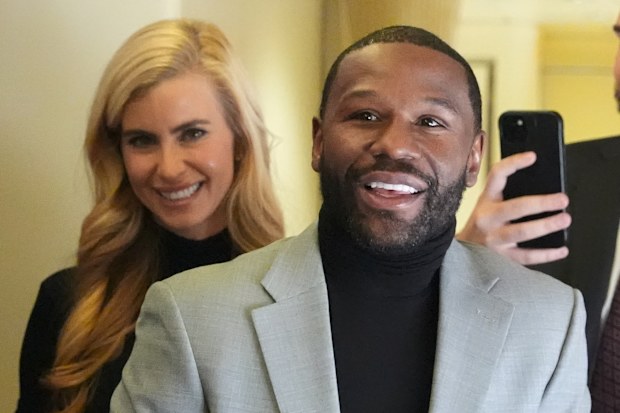 Katie Zacharia aboard Air Force One with boxer Floyd Mayweather.