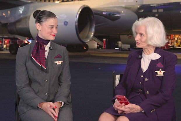 Two women in flight attendant uniforms