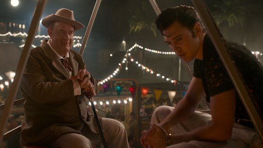 Tom Hanks as Colonel Tom Parker and Austin Butler as Elvis Presley in Elvis.