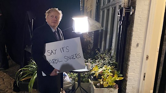 “Say it’s carol singers” UK Prime Minister Boris Johnson is photographed behind the scenes of his Love Actually parody.