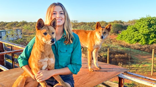 Zali Jestrimski at Wooleen Station with dingoes Eulalia and Steven.