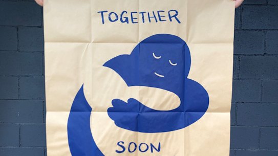 Artist Peter Drew and his Hugs poster