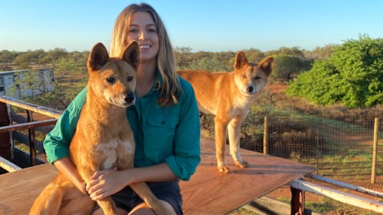 Zali Jestrimski at Wooleen Station with dingoes Eulalia and Steven.