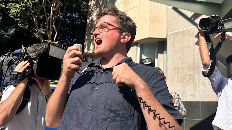 First person charged under Qld hate speech laws fronts court, says he won’t stop protests