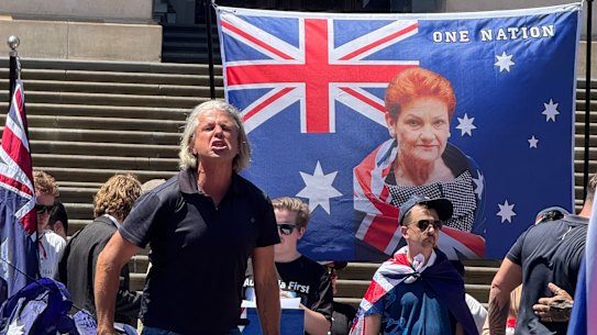 A One Nation flag with Pauline Hanson’s face is seen at the March for Australia rally on Australia Day.