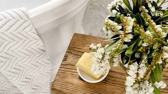 Clean towels, fresh flowers and scented soap are a good starting point for a guest-friendly bathroom.