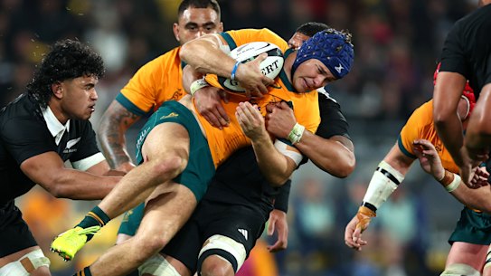 WELLINGTON, NEW ZEALAND - SEPTEMBER 28: Josh Flook of Australia is tackled during The Rugby Championship & Bledisloe Cup match between New Zealand All Blacks and Australia Wallabies at Sky Stadium on September 28, 2024 in Wellington, New Zealand. (Photo by Phil Walter/Getty Images)