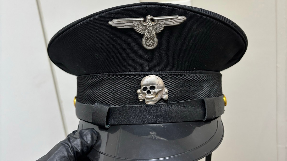 Man charged after Nazi-branded items found at Sydney home