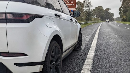 A with two blown tyres on the side of the Hume Freeway.