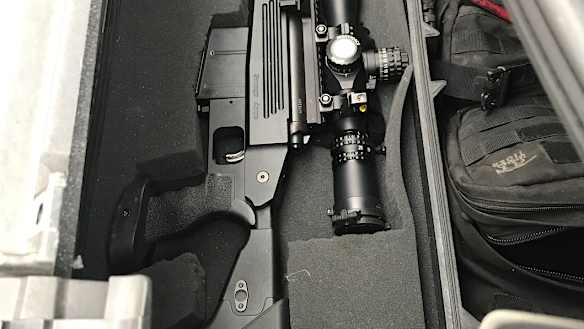 Raid uncovers stolen police badges, rifle, and ammo