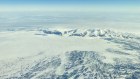 Excitement mounts with the first view of Antarctica from the window of the Qantas Dreamliner.