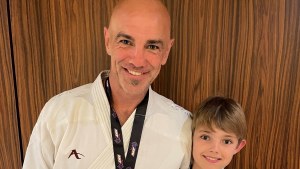 Paul Taylor with son Oscar after the 2021 Australian Open tournament. Paul’s first memory of karate is of Oscar’s first karate class.