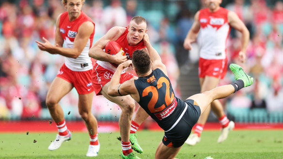 Chad Warner shrugs off the tackle of Josh Kelly.