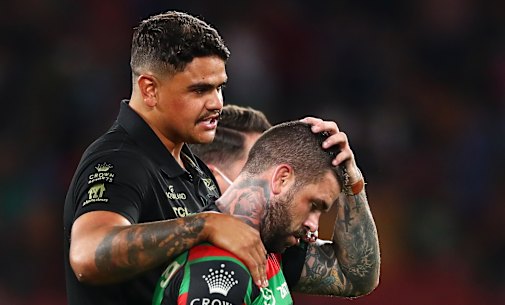Latrell Mitchell consoles Adam Reynolds after the grand final.