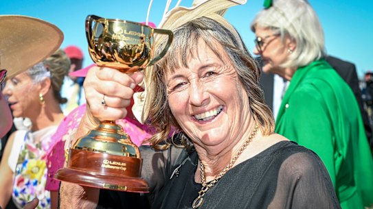 Sheila Laxon shows off the trophy.