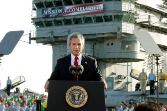 President George W. Bush declaring the end of major combat in Iraq in 2003, but the war dragged on for many years after that.