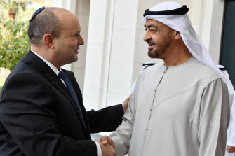 Israeli Prime Minister Naftali Bennett, left, shakes hands with Sheikh Mohammed bin Zayed Al Nahyan, the crown prince of Abu Dhabi and de facto ruler of the United Arab Emirates, in Abu Dhabi, on December 13. The countries have recently reestablished relations.