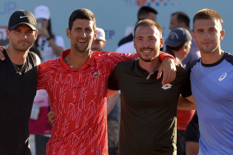 Novak Djokovic, second from left, poses with Bulgaria's Grigor Dimitrov (left), Serbia's Viktor Troicki and Croatia's Borna Coric in Croatia. All have tested positive to COVID-19.