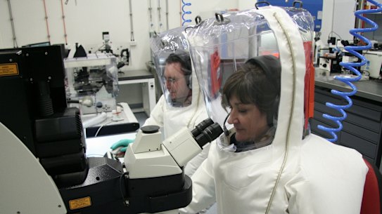 CSIRO scientists working in a secure area at CSIRO’s Australian Animal Health Laboratory, a high-containment facility in Geelong.
