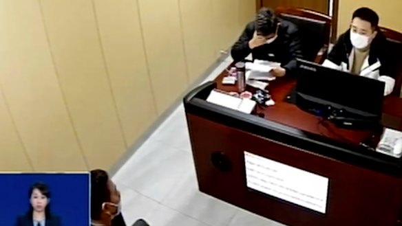 Police interrogate a suspect in connection with fake COVID-19 vaccines in a detention centre in Kunshan in eastern China’s Jiangsu Province in December.