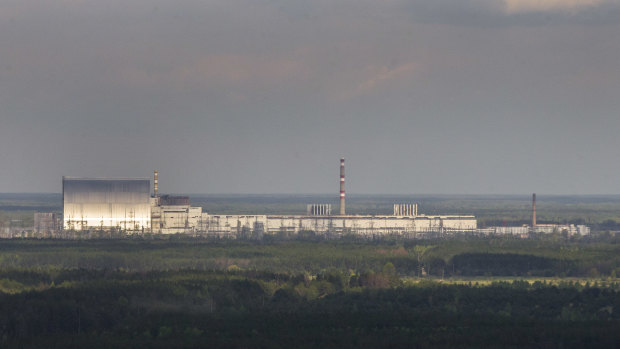 An aerial view of the Chernobyl nuclear power plant and a new shelter, left, installed over the exploded reactor in Chernobyl, Ukraine.