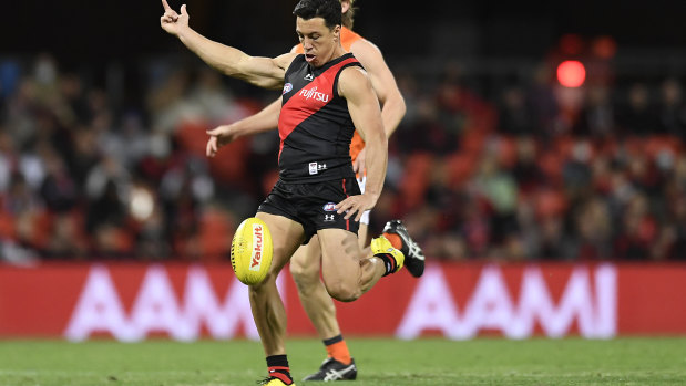 Dylan Shiel gets a kick away against his former side, the Giants, at Metricon Stadium.