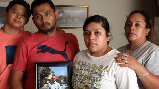 The Maldonado family, Benjamin Maldonado, Sr., second from left, and his wife Adriana Garcia right, with children Benjamine Maldonado, Jr, left, and Xitlali Raya Garcia, second from right at their San Lorenzo, California home, with a portrait of their son Jovani, 15, who was killed when a Tesla operating on autopilot rear-ended the family’s pickup truck. The family is suing Tesla, claiming its Autopilot system was partly responsible. 