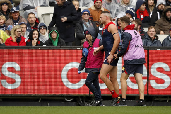 Steven May leaves the field during Sunday’s clash with Geelong.