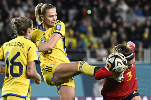 Sweden’s Fridolina Rolfo attempts to kick the ball clear of Spain’s Teresa Abelleira, but accidentally makes contact with the head.
