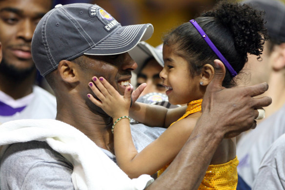 Kobe Bryant celebrates with his daughter Gianna following the Lakers' NBA victory in 2009.