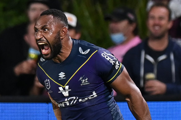 Justin Olam celebrates his 76th-minute try for the preliminary-final bound Storm on Friday night.