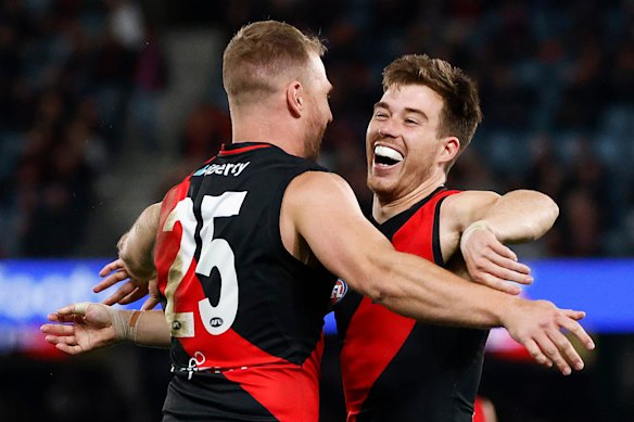 In happier red-and-black times: Jake Stringer and Zach Merrett as teammates in 2023.