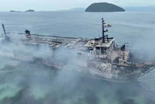 The smouldering remains of the ferry MV June Aster that caught fire off Palawan province, western Philippines.