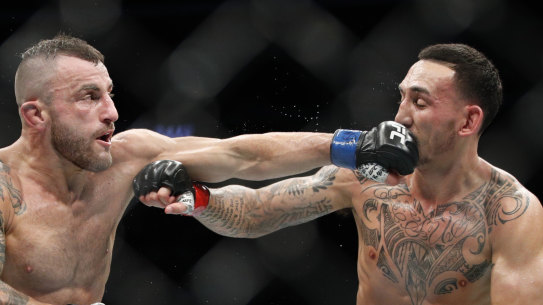 Australia's Alexander Volkanovski (left) was a unanimous winner over Max Holloway on Sunday.
