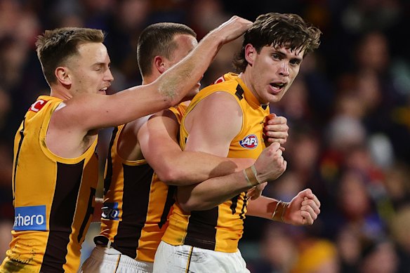 Will Day of the Hawks celebrates a goal with teammates.