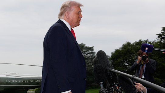 Donald Trump speaks to journalists.