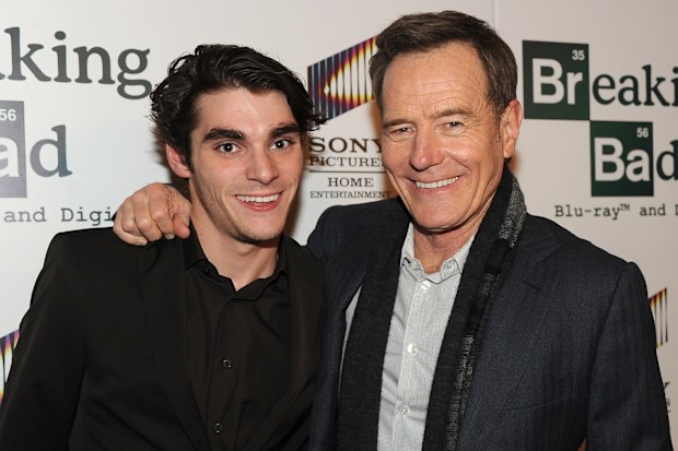 LOS ANGELES, CA - NOVEMBER 25: Actors RJ Mitte (L) and Bryan Cranston arrive at the screening of “No Half Measures: Creating The Final Season Of Breaking Bad” DVD Launch at Pacific Theatres at the Grove on November 25, 2013 in Los Angeles, California. (Photo by Kevin Winter/Getty Images)