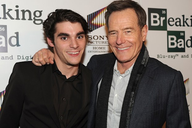 LOS ANGELES, CA - NOVEMBER 25: Actors RJ Mitte (L) and Bryan Cranston arrive at the screening of “No Half Measures: Creating The Final Season Of Breaking Bad” DVD Launch at Pacific Theatres at the Grove on November 25, 2013 in Los Angeles, California. (Photo by Kevin Winter/Getty Images)