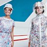 Hostesses model 1960s Pucci uniforms in front of Lockheed’s supersonic transport full-size mockup.