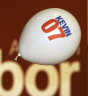 Supporters play with a balloon before Australia’s new Prime Minister Kevin Rudd delivers his acceptance speech, 2007.