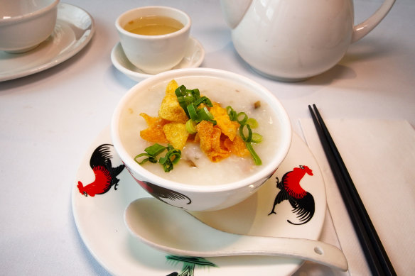 Congee with century egg, roast pork and crisp wonton skin.