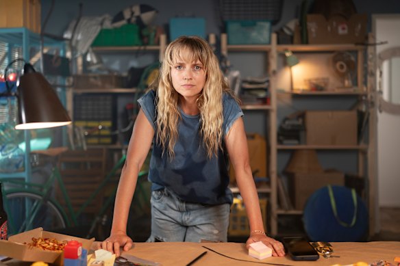 Teresa Palmer as Isabelle, an outsider who disrupts a previously quiet neighbourhood, in The Family Next Door