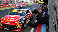 2024 Bathurst 1000 winner Brodie Kostecki and Todd Hazelwood cross the finish line to cheers from their team. 