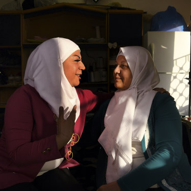 Lara Shaheen, 36, (left) talks with her mother, Hasna’a al-Beesh, 56, in the sewing room at Jasmine Foundation in Irbid, Jordan.